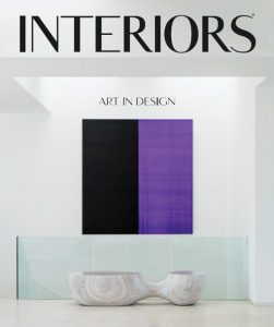 A modern interiors magazine cover featuring a minimalist design a bold black and purple artwork and a sleek glass railing