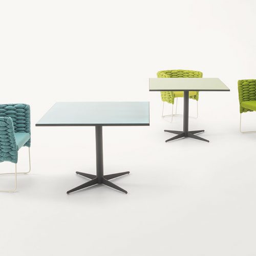 Two Cafe square tables, top one in blue and one in green and black steel central leg with four spokes on a white background.