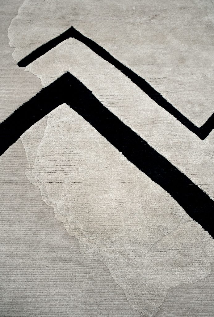 Atla Pattern Two rug, Weft and warp in cotton and hand-spun and Tibetan wool in white and black triangle pattern.