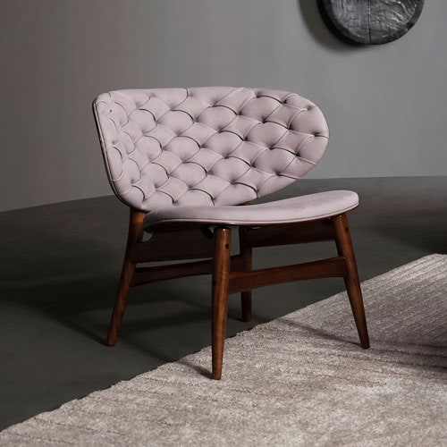 wooden and leather armchair in light pink tone.