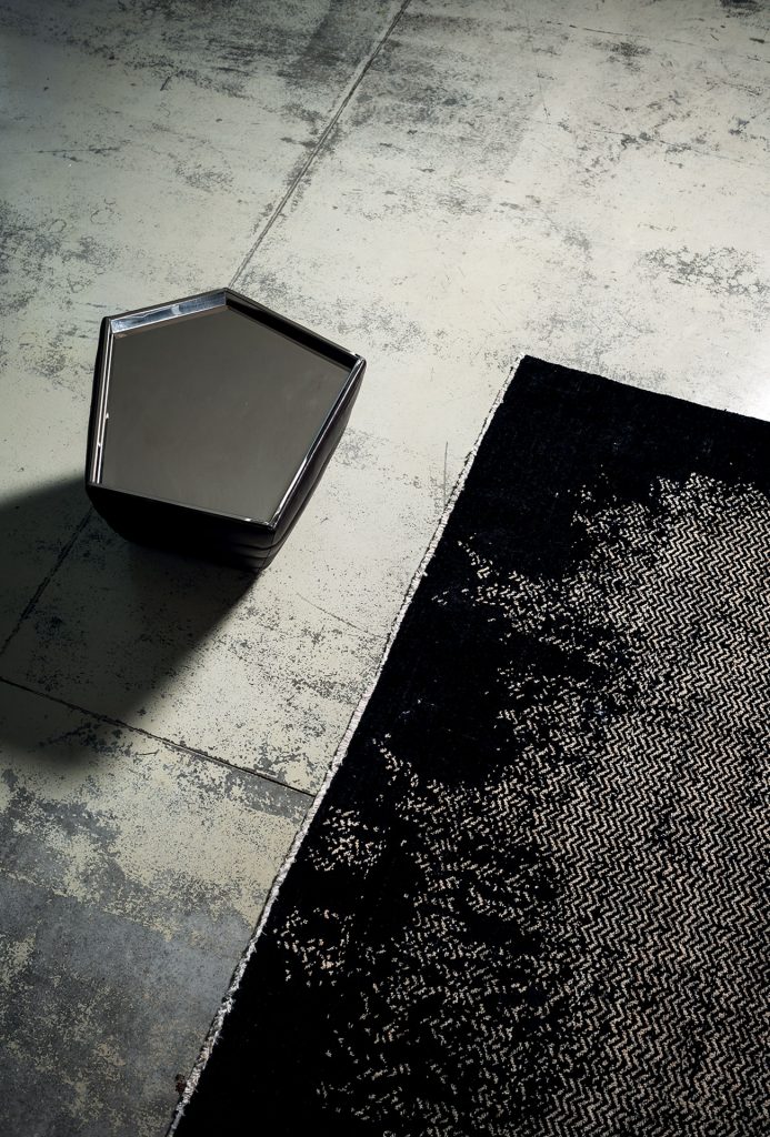 A Scarlet Twill rug, made of wools, hand-dyed in white and black pattern on the floor.