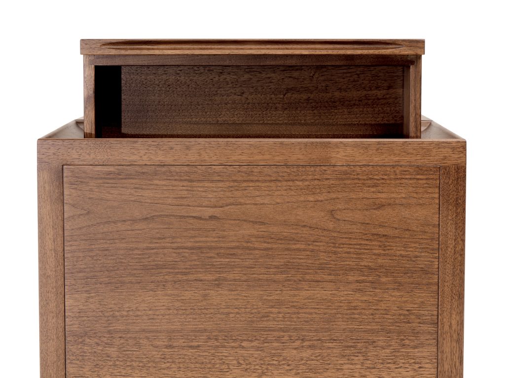 Close up of one of the Brad Nightstands opening the drawer