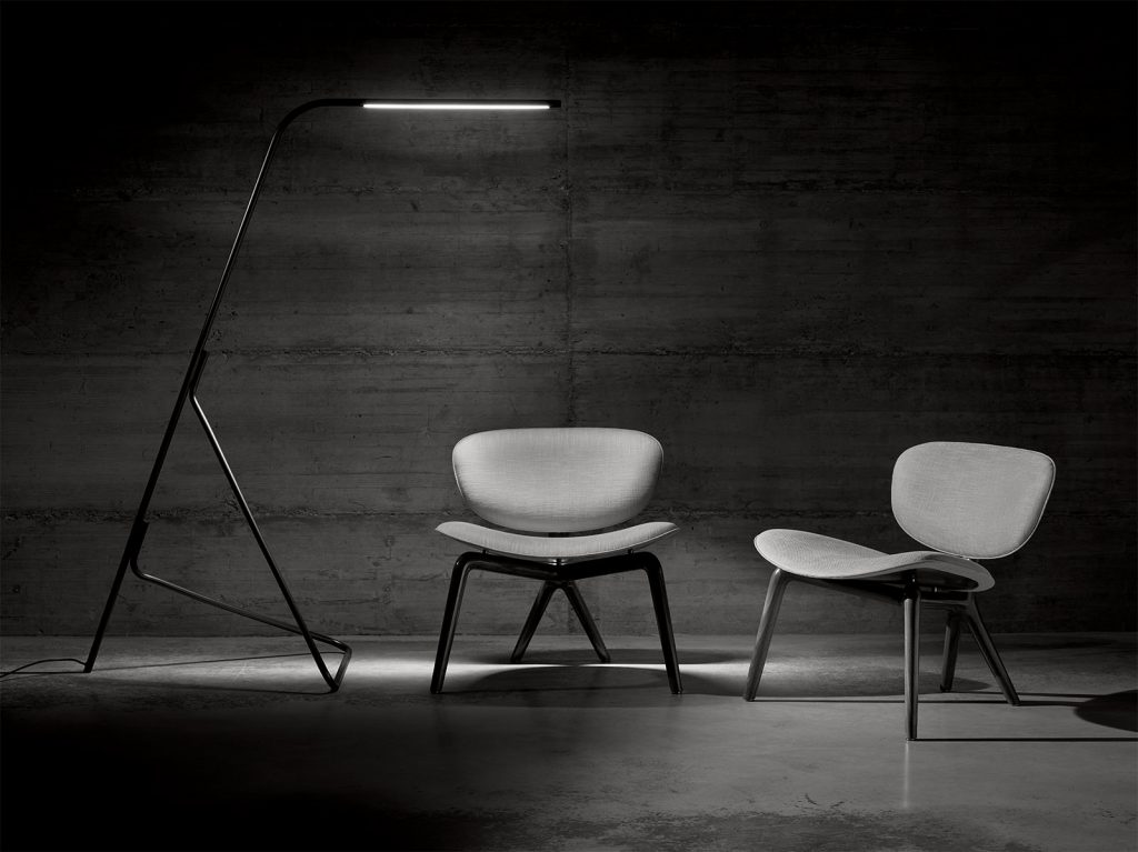 slim lamp made of brass in a black and white color tone in a living room