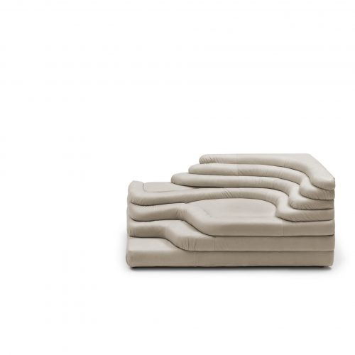 A white cream DS Thousand twenty five sofa element. The single element is a terraced hill with widths and depths that vary in tapering steps on a white background.