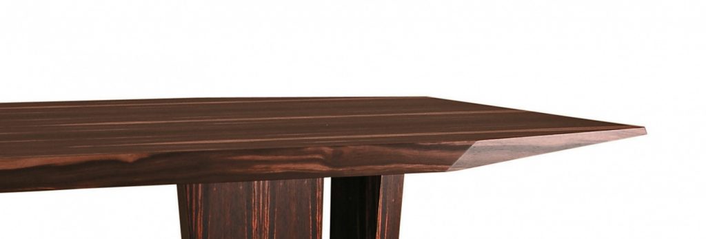 table characterized by the facets on the top made on a wood base flamed on a white background