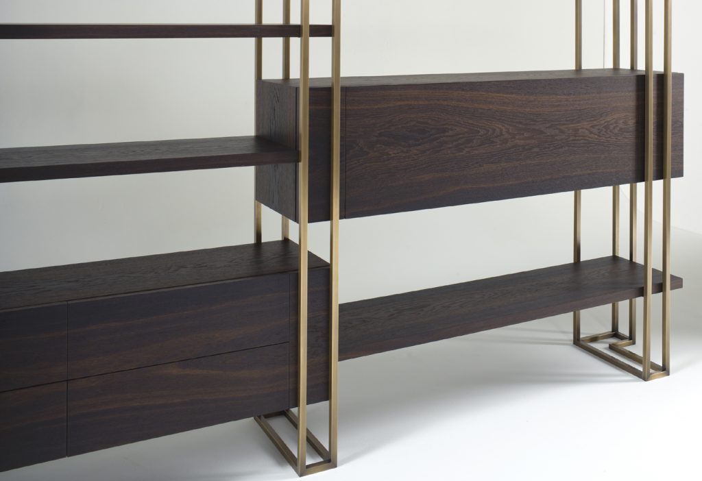 Emm BookCage – A modern bookcase with a geometric design and warm wood finish, perfect for organizing books in a stylish living room or home library.