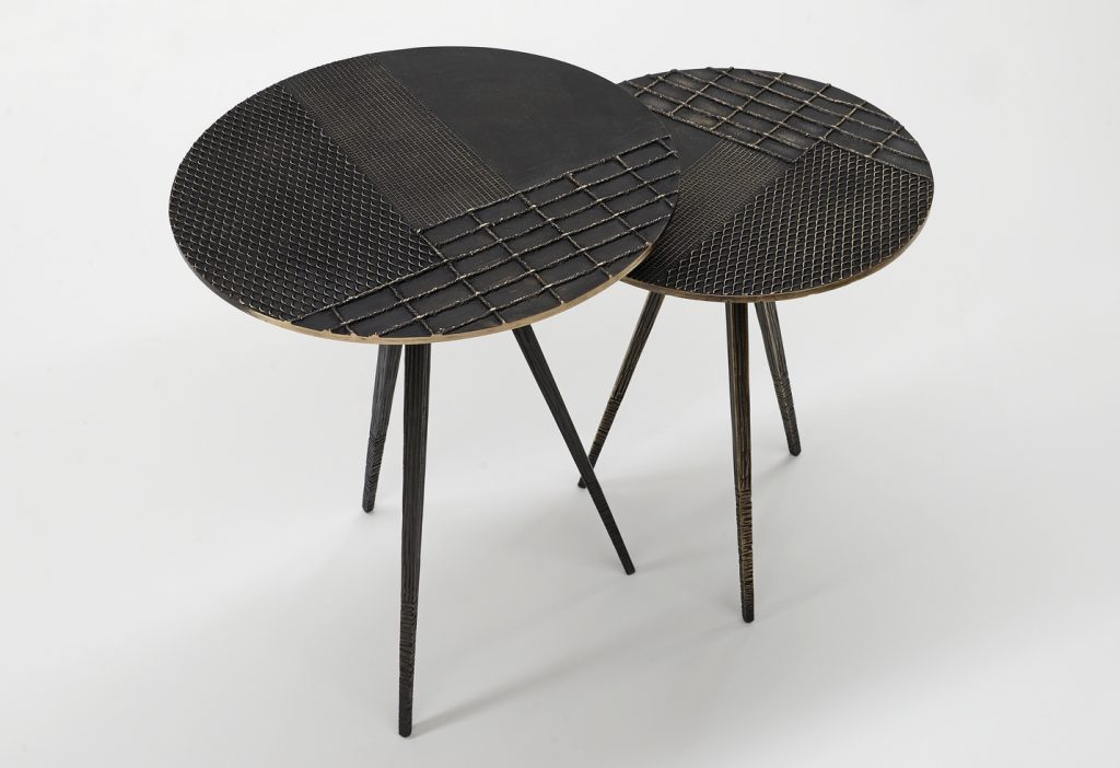 two coffee tables with surfaces decorated on a wooden base and textures in a black color tone