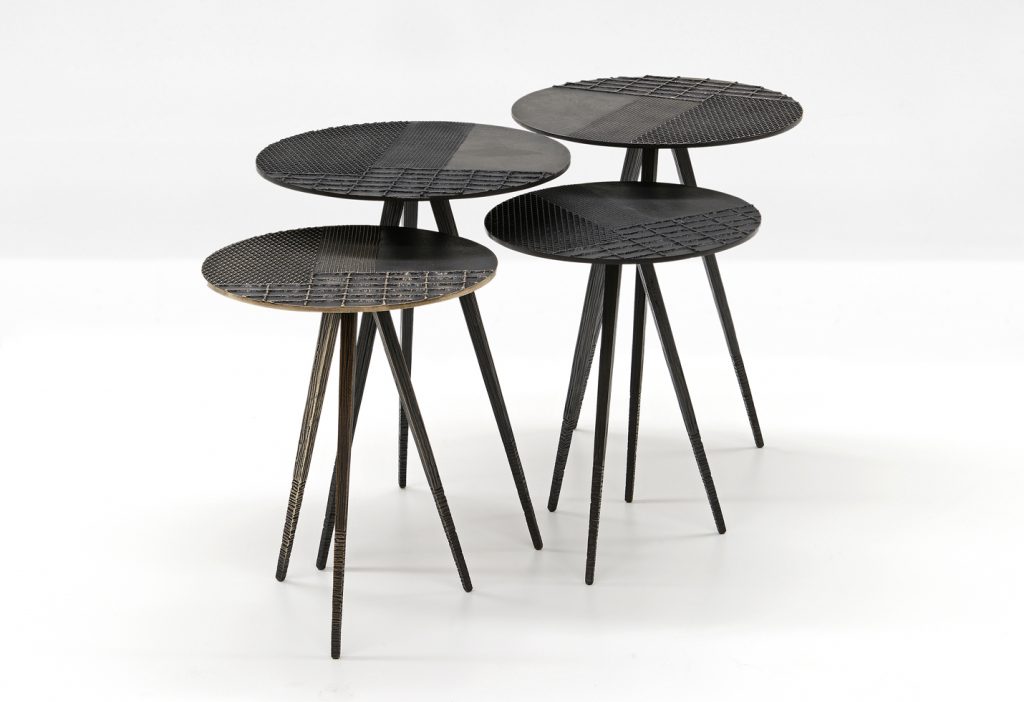 four coffee tables with surfaces decorated on a wooden base and textures in a black color tone