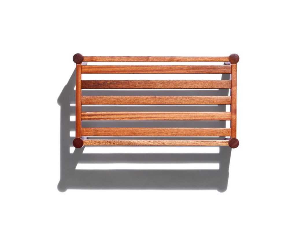 Vieste Pouf: Rectangular pouf base with four brown legs on a white background.
