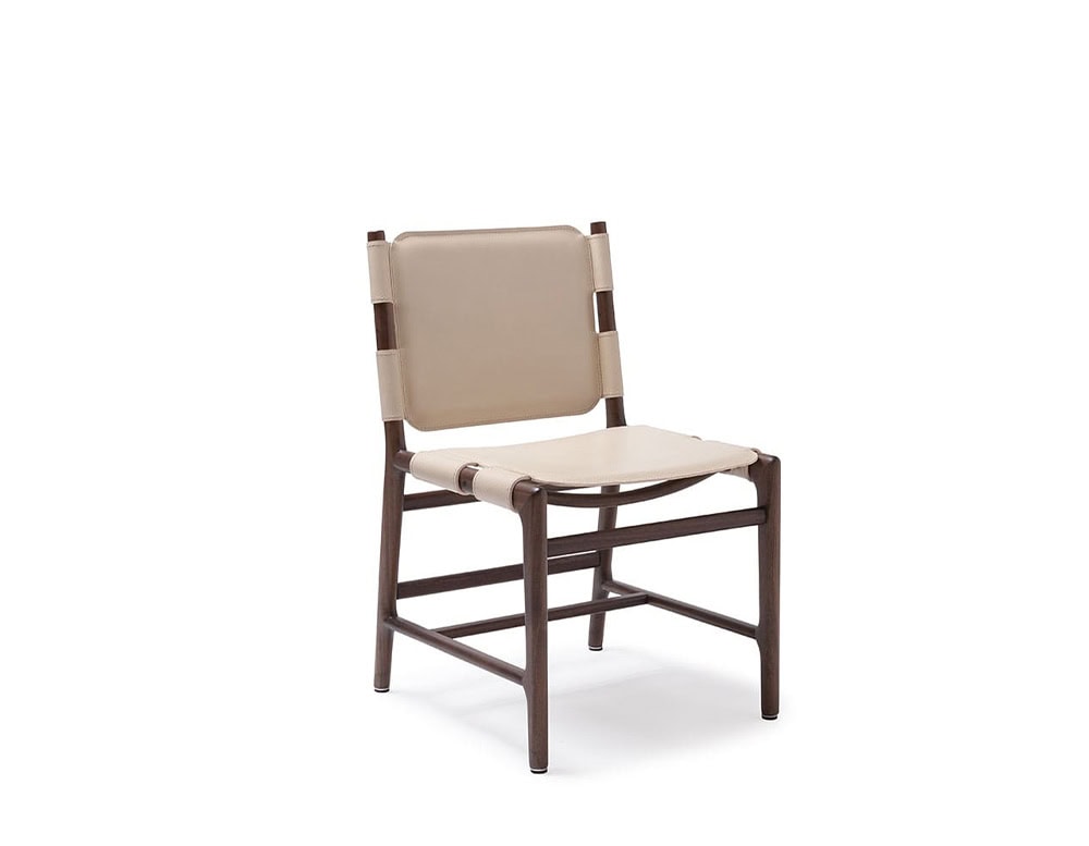 Levante Chair. Structure in brown wood, seat and backrest in white leather with brown cushion on a terrace.