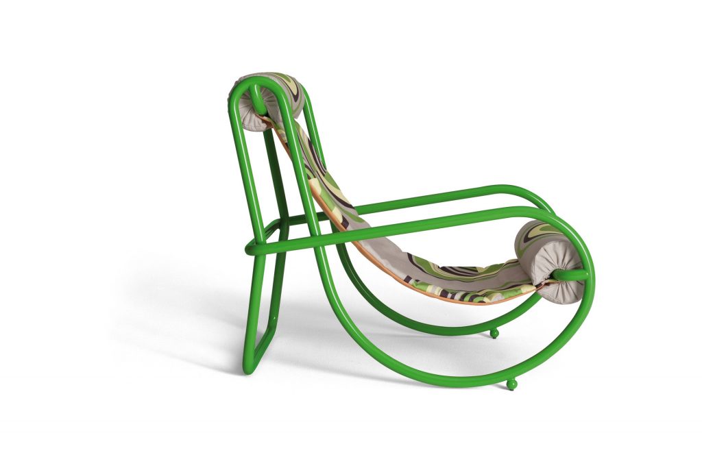locus solus armchair in green with a green background