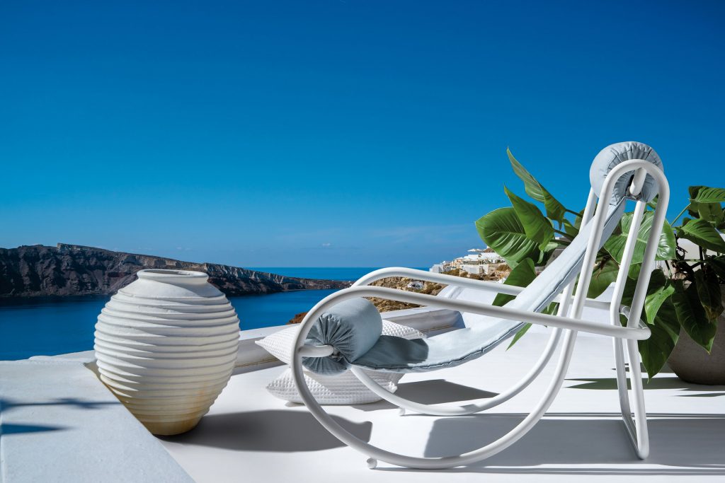 locus solus armchair in white with an ocean view