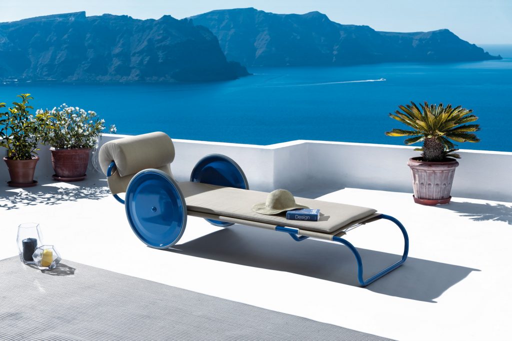 locus solus sun lounger in blue with an ocea view and mountains