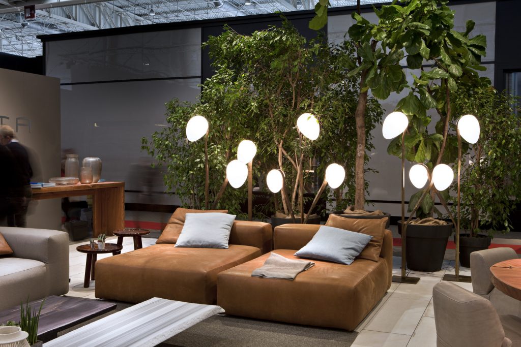 two montecarlo chaicse lounges in brown leather with some plants