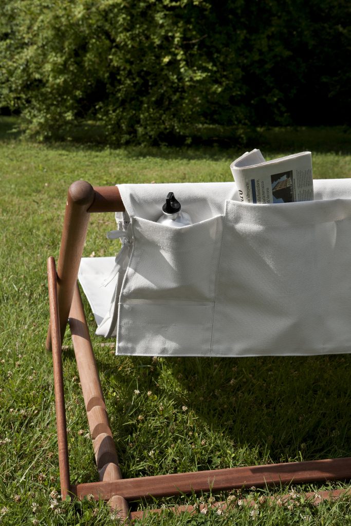 paraggi white sofa showcasing the storage pockets in the backrest