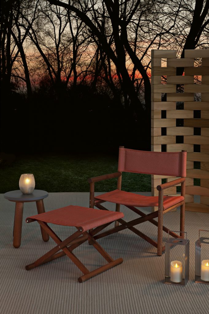 paraggi armchair in red colored fabric in an outdoor area