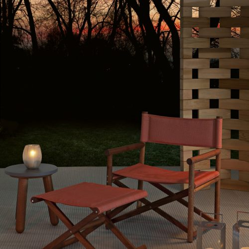 paraggi armchair in red colored fabric in an outdoor area