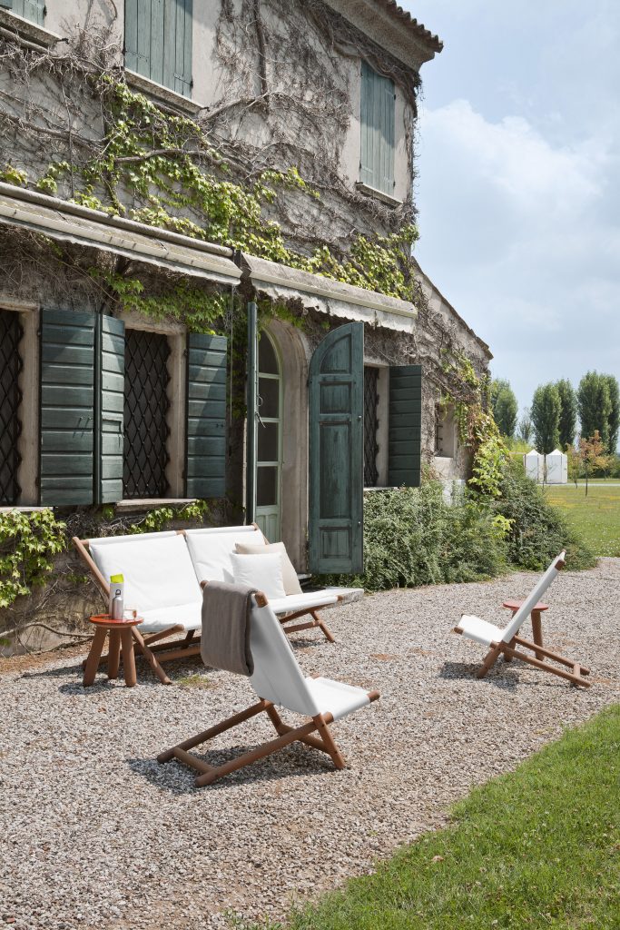 two paraggi beach chair in an outdoor setting with a white colored sofa