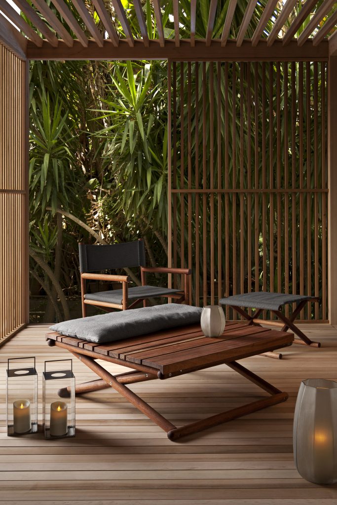 paraggi coffee table in an outdoor area surrounded by furniture