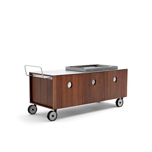 Roller Kitchen cabin covered in brown wooden with four wheels against a wall.