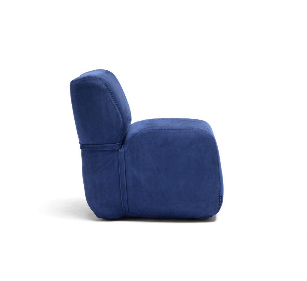 side view of the soft armchair in dark blue