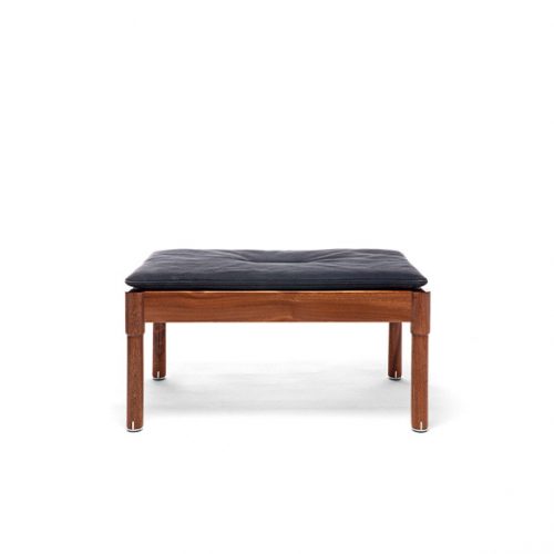 A Vieste Outdoor Pouf with a dark cushion and wooden legs is shown against a white background