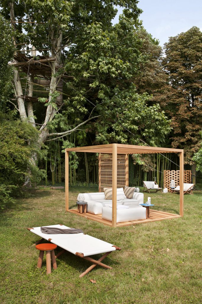 zen light cabana in cedar in a patio area with a white sofa and a sunbed next to it