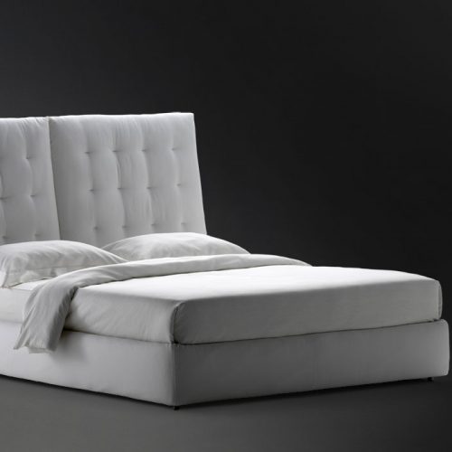 white angle quilted headboard with white sheets