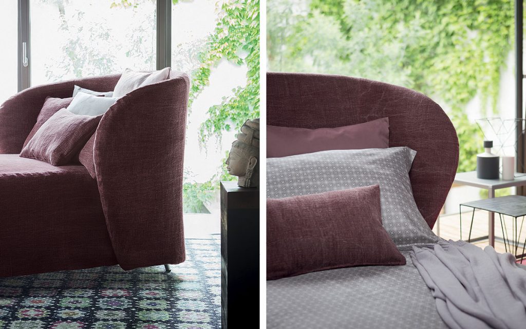 Two Celine Armchair Sleepers in purple. White, gray and purple pillows and wheels in a bedroom.