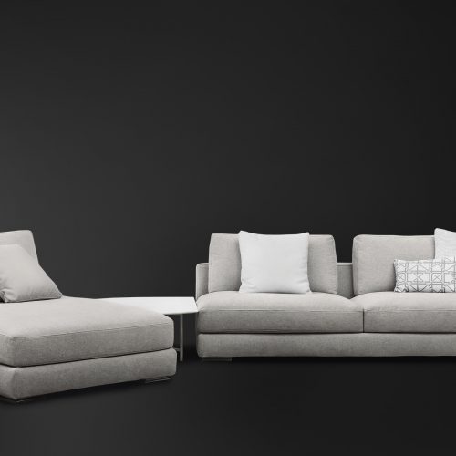 Myplace A: White modular sofa, one seat on left, two on right, on a black background.