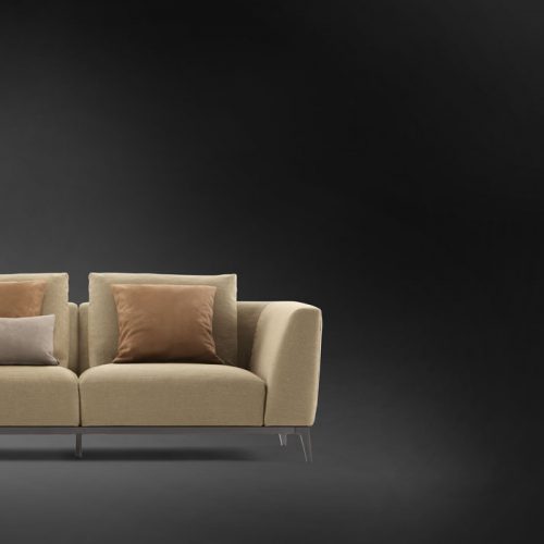 Olivier A sofa upholstered in brown fabric and five legs in steel on a black background.