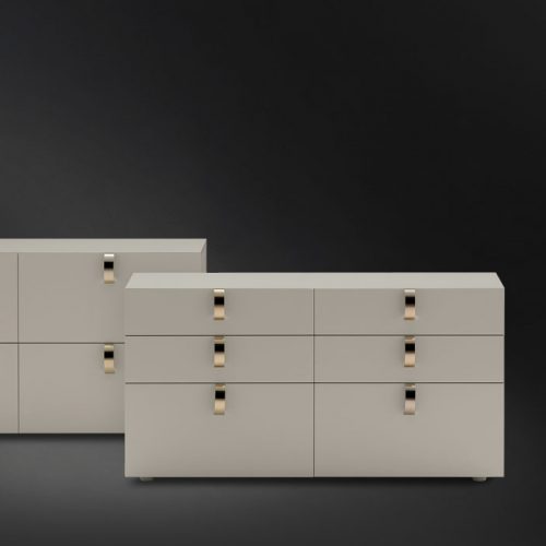Two Splendor Dressers in white and handles in dipped gold on a black background.