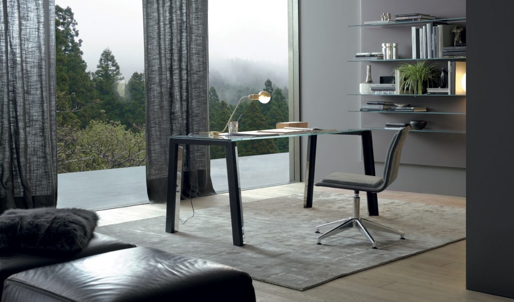 WGS table with crystal rectangle top eaturing wooden legs and a sleek metal frame in an office.