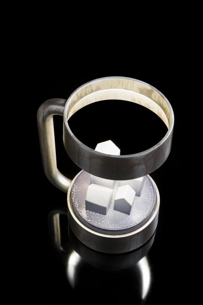 Compound Light silver finish structure and stone design in the center on a black background.