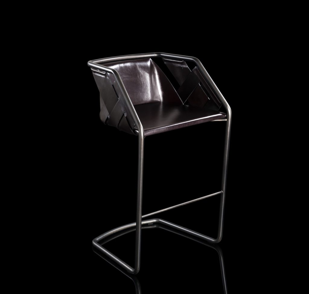 Strip Stool. Structure in curved black metal frame, seat covered with brown leather on a black background.