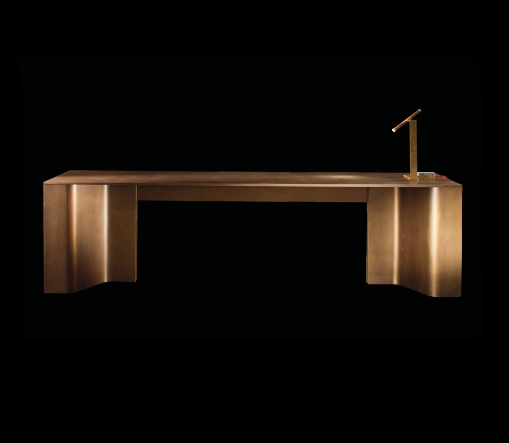 Time Table, top in wood and two legs in burnished brass on a black background.