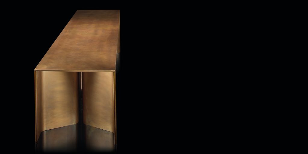 Time Table with two legs, structure in natural wood cover in burnished brass on a black background.