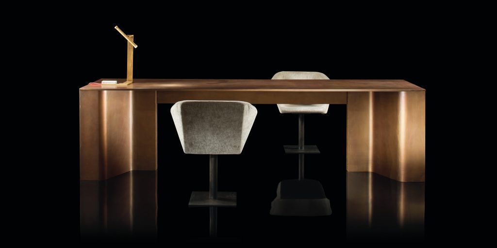 Time Table, top in natural wood and two legs in burnished brass on a black background.