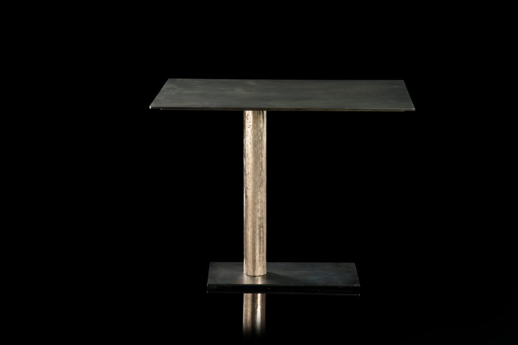 Square Twistable Coffe Table And Consolle. Structure support in black, top in black metal and central leg in burnished titanio on a black background.