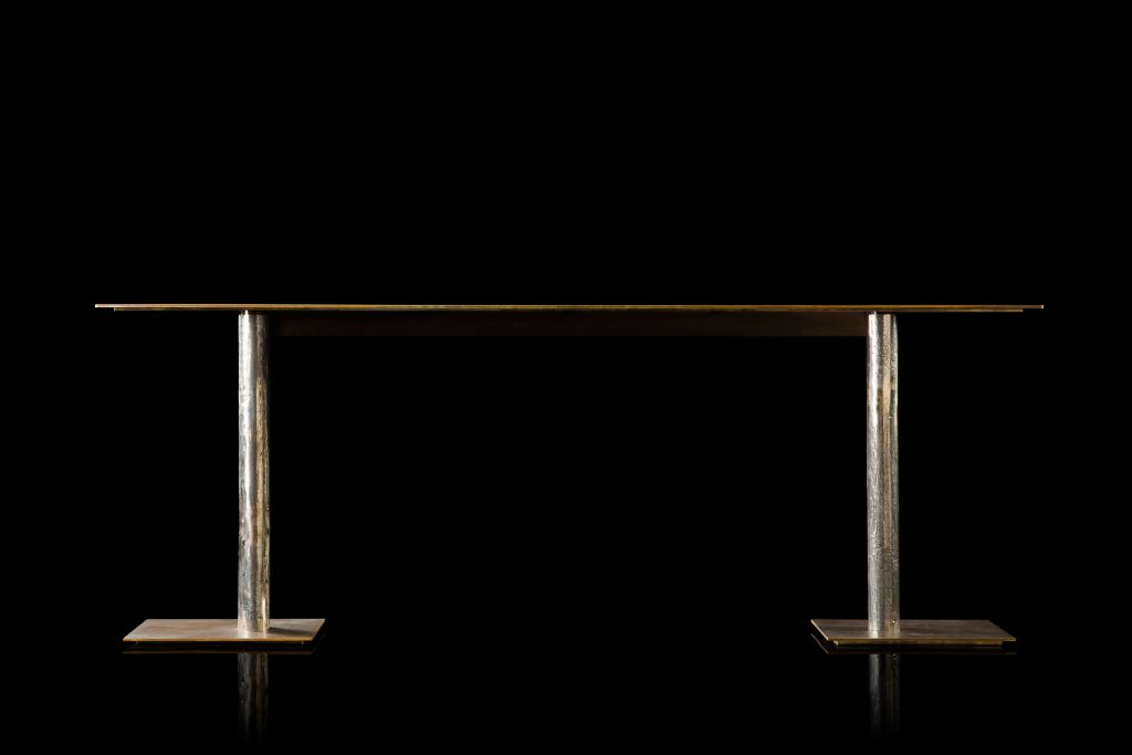 Rectangle Twistable Coffe Table And Consolle. Structure support in bronze, top in bronze metal and central leg in burnished titanio on a black background.