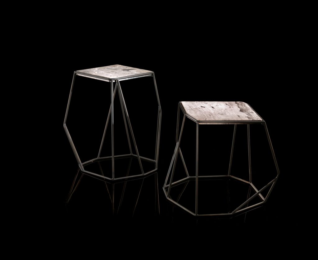 Two W Tables, structure in black rod metal, diamond like shape. Top in natural wood on a black background.