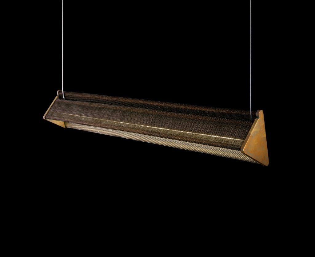 Y-Light of y-shaped body with steel suspension cables. Finish structure in brass on a black background.