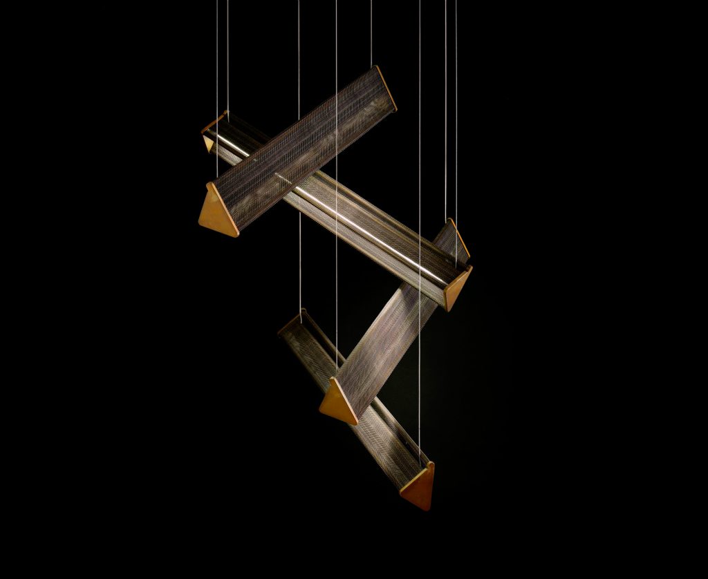 Four Y Lights of y shaped body with steel suspension cables. Finish structure in brass on a black background.