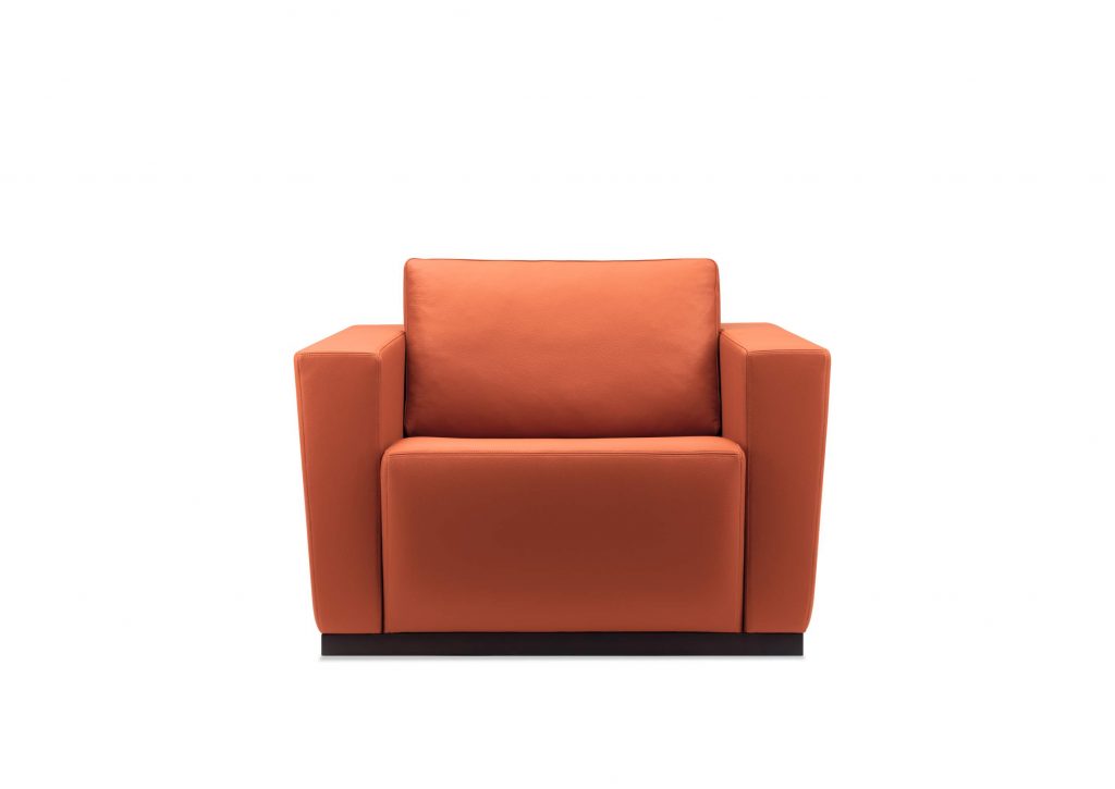 Elton armchair with a wooden frame and orange upholstered cushions, on a light background.
