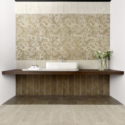 Fenice finish mosaic in beige and brown with phoenix-inspired patterns, in a bathroom.