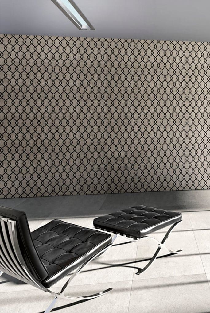 Fortune finish mosaic in dark brown with intricate fortune-inspired patterns on a wall.