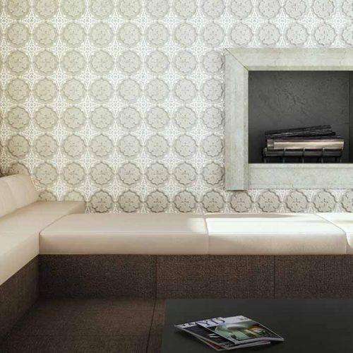 Waerlily marble with green floral patterns in front of a small couch.