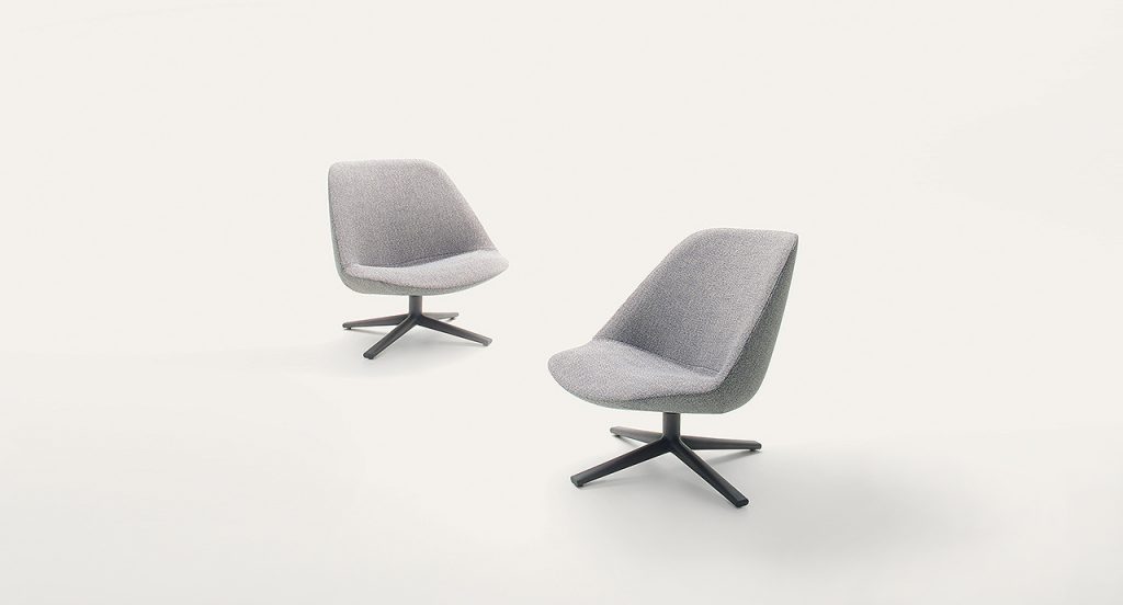 Two Swiveling and tilting Adele Armchairs, gray upholstery cover and black wooden base with four spokes on a white background.