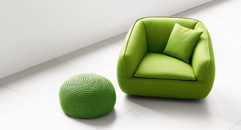 Two Bask S armchairs, green upholstery in a living room.