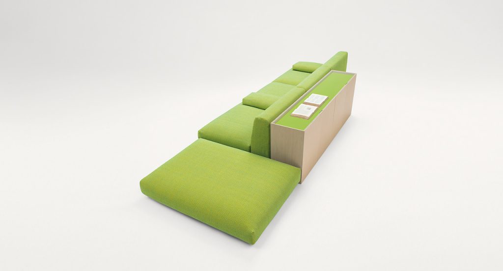 Green square Move Pouf, upholstery in green fabric in a living room.